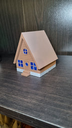 Cabane Cozy de Noël posée sur une étagère, décoration village de Noël, Tresor3D
