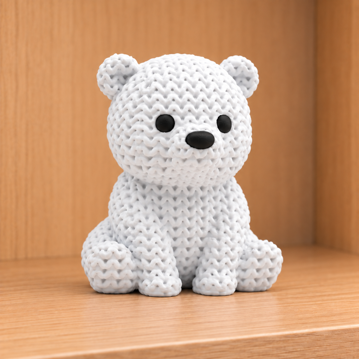 Figurine bébé ours polaire kawaii effet tricoté, détail de la texture tricotée