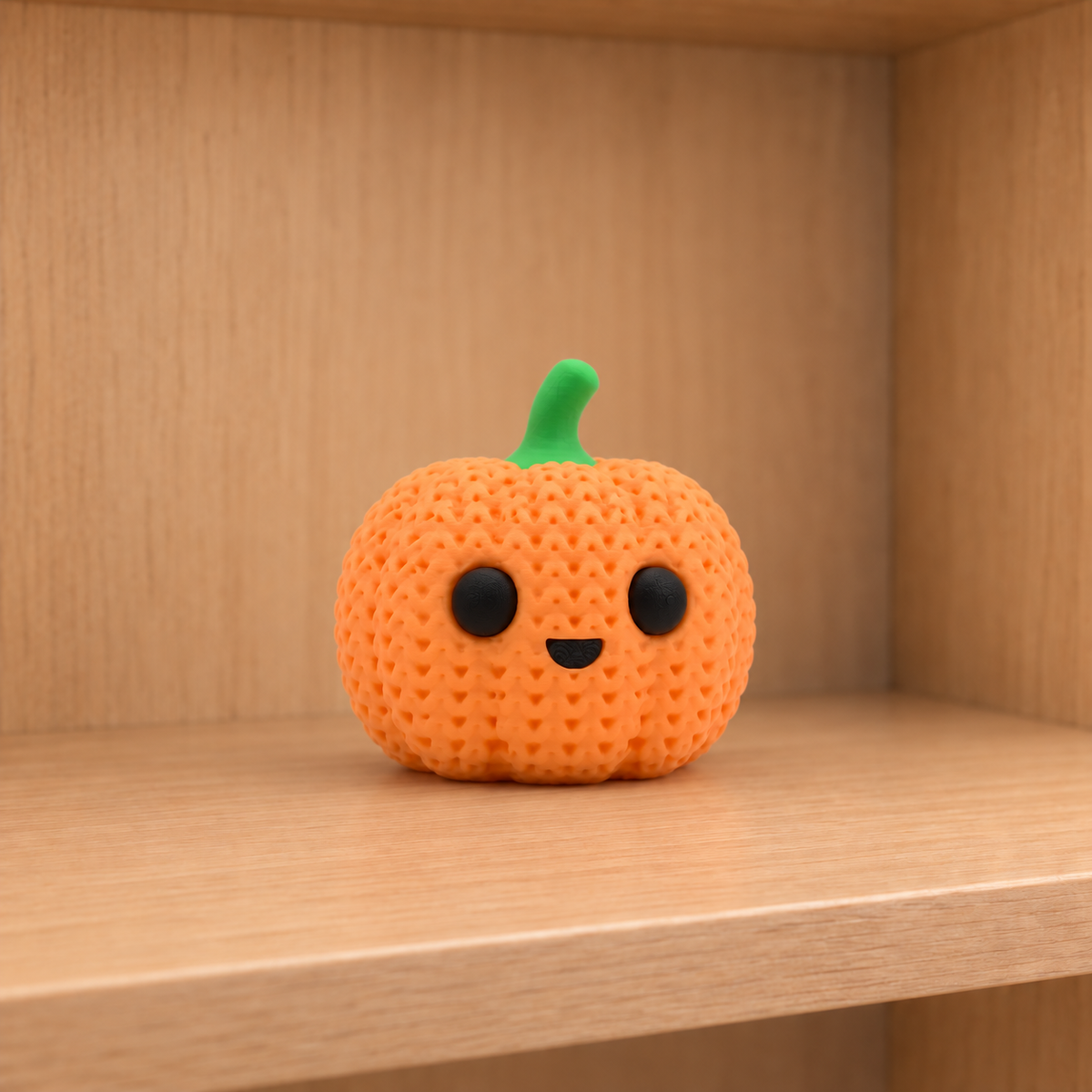 Figurine citrouille souriante d'halloween kawaii effet tricoté, vue de face