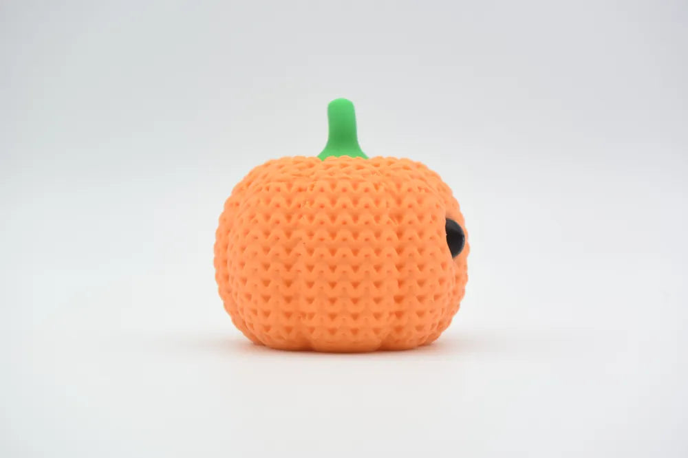 Figurine citrouille souriante d'halloween kawaii effet tricoté, vue arrière