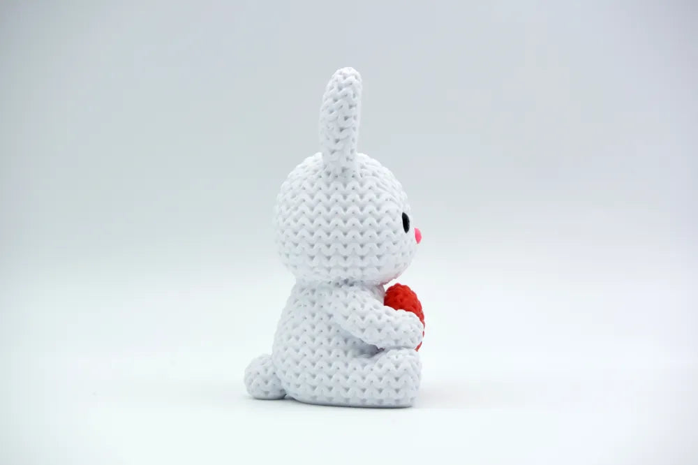 Figurine lapin au cœur kawaii effet tricoté, vue arrière