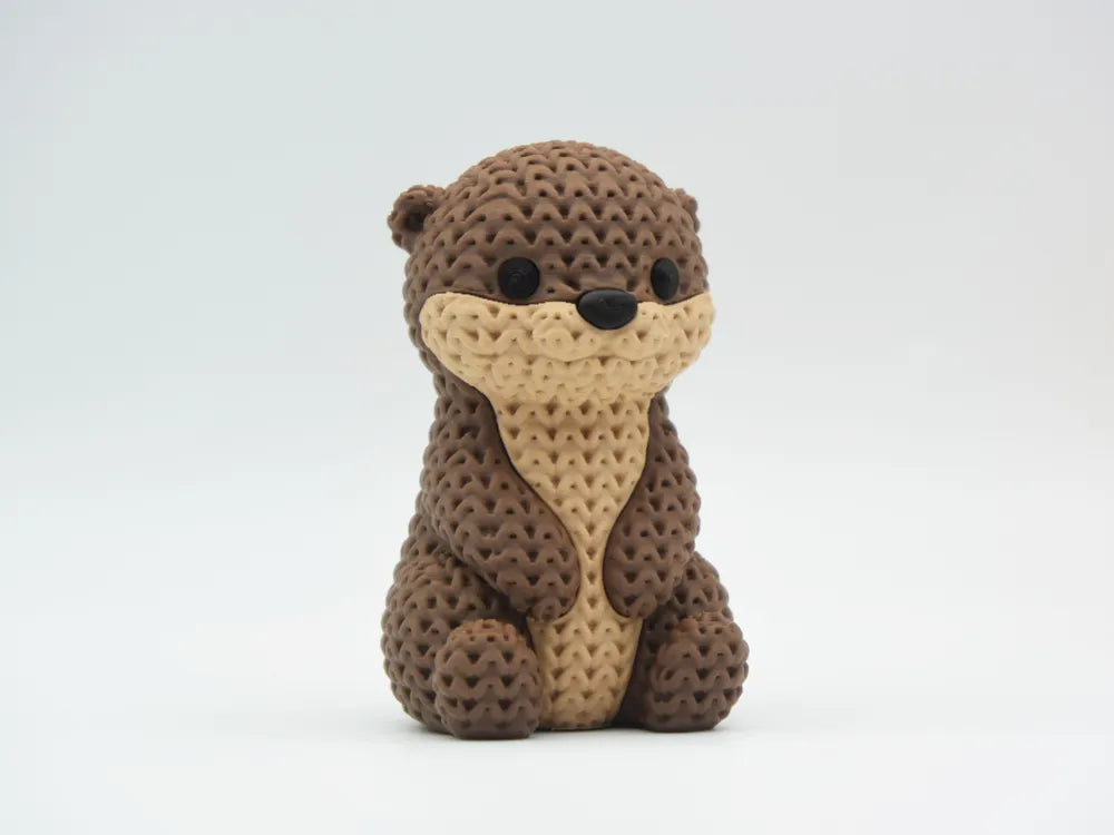 Figurine loutre kawaii effet tricoté, vue arrière