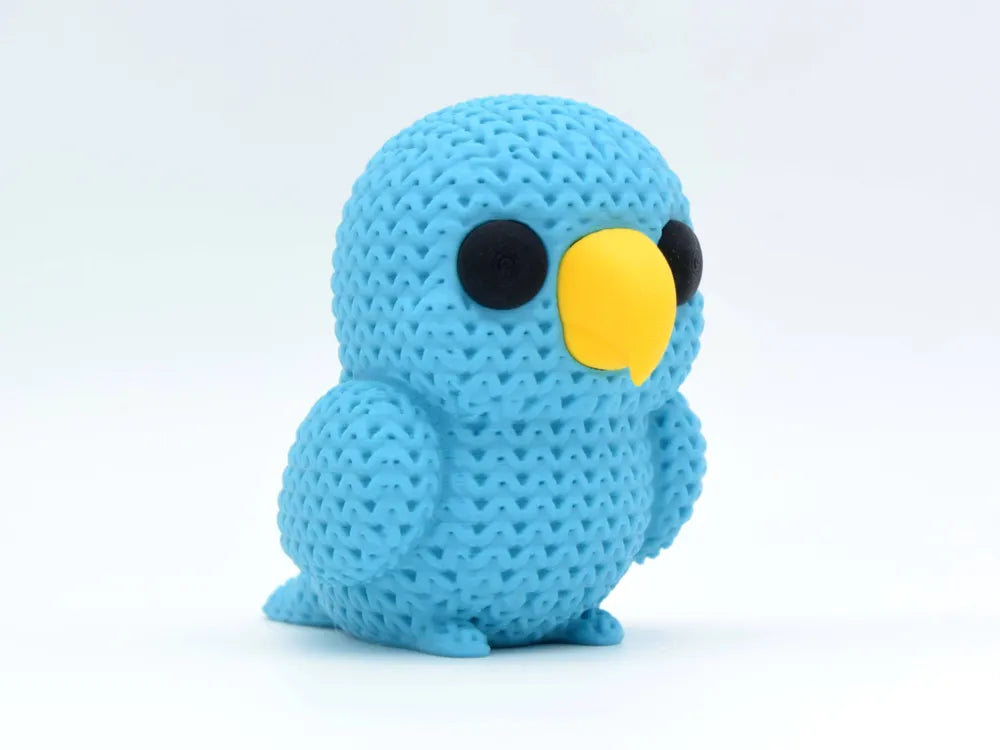 Figurine perroquet kawaii effet tricoté, vue de profil