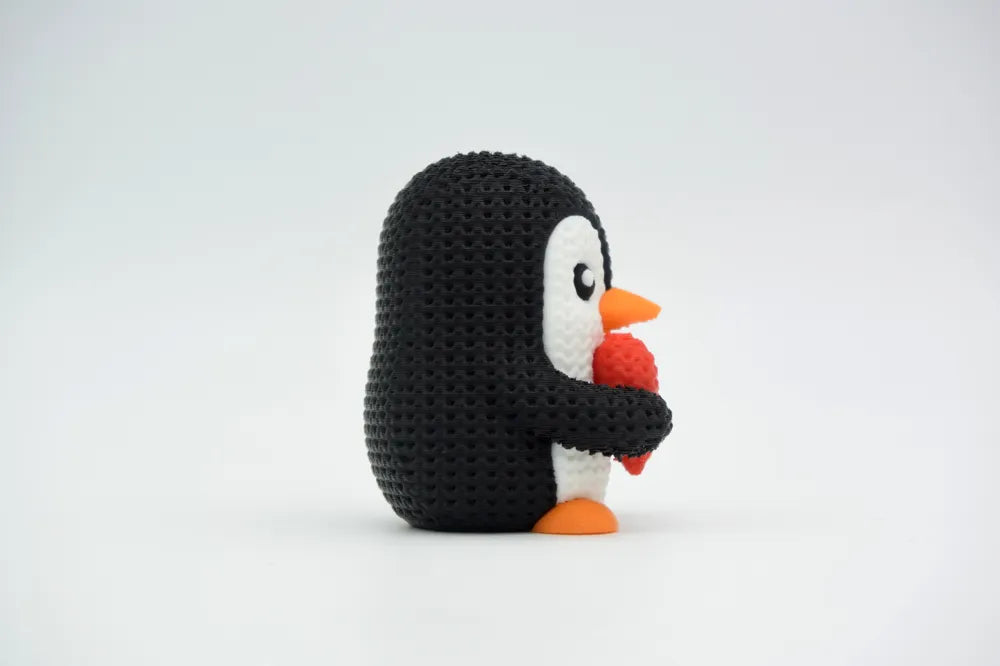 Figurine pingouin au cœur kawaii effet tricoté, vue arrière