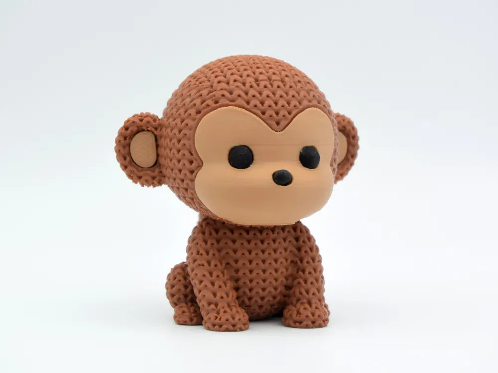 Figurine singe kawaii effet tricoté, vue de profil
